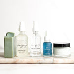 5 Pretty farm girl products on a marble slab and a white background.