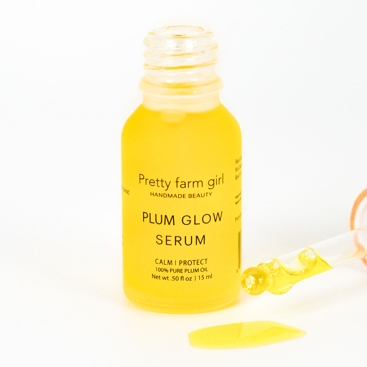 Plum Glow Serum being poured into glass bottle