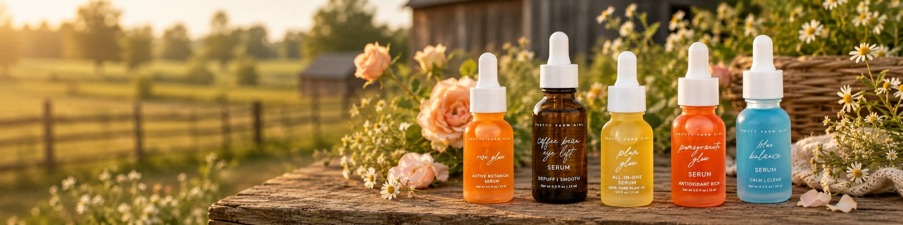 A collection of Pretty Farm Girl Serums laying on their side.