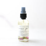 Clear bottle with a spray top on a white background