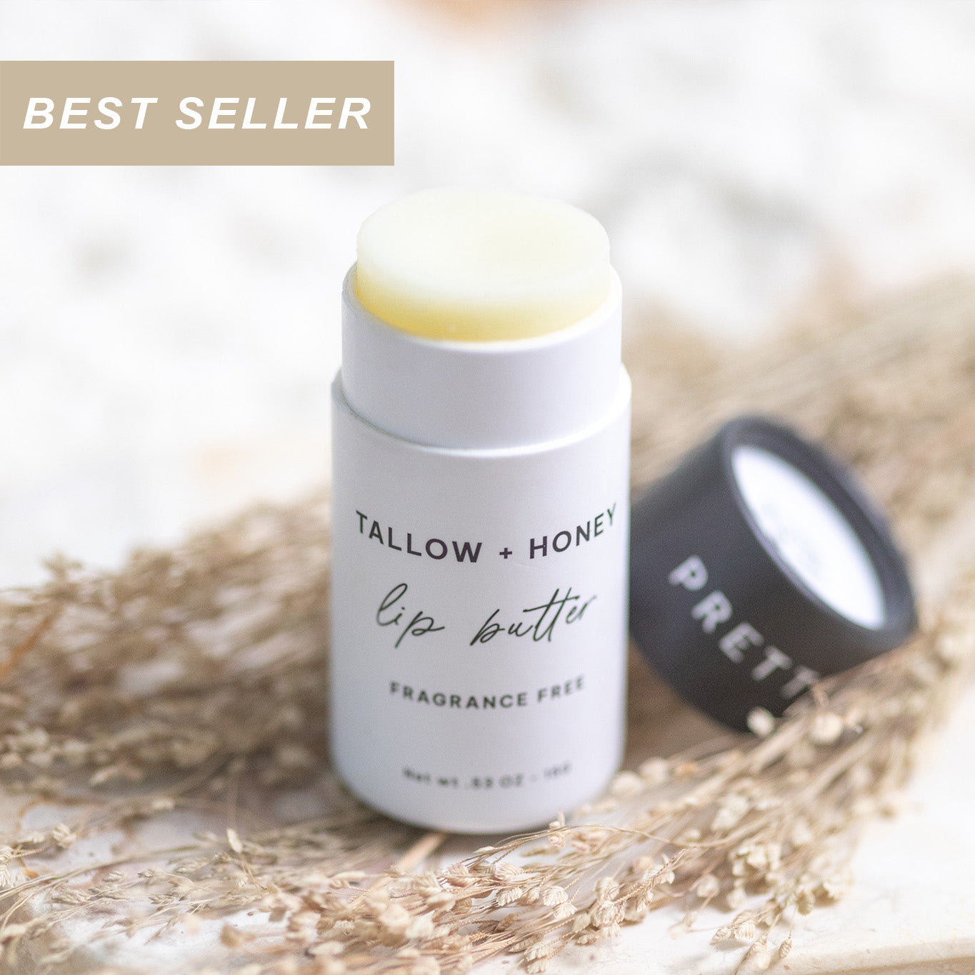 Lip butter with fragrance free 'Tallow + Honey' on a natural background and a best seller label in the corner