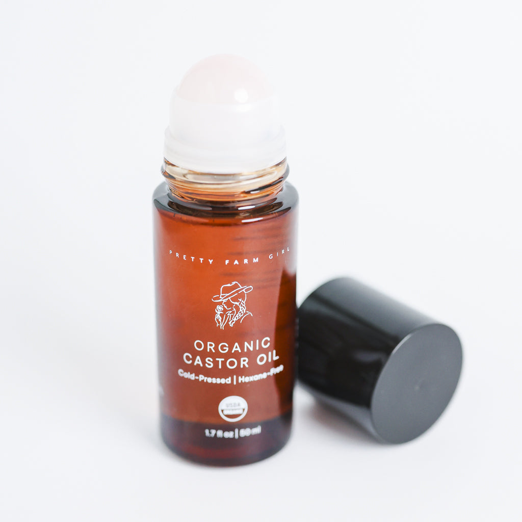 Pretty Farm Girl Organic Castor Oil roller 1.7 fl oz with rose quartz ball applicator and black cap