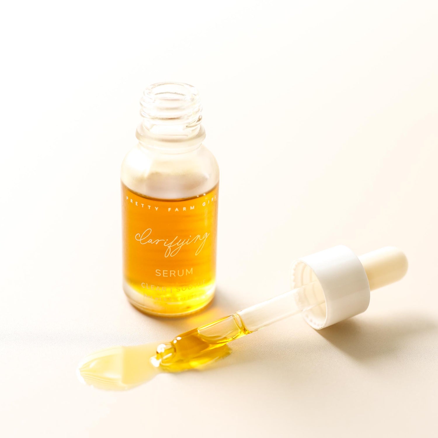 Serum bottle with dropper on a light background