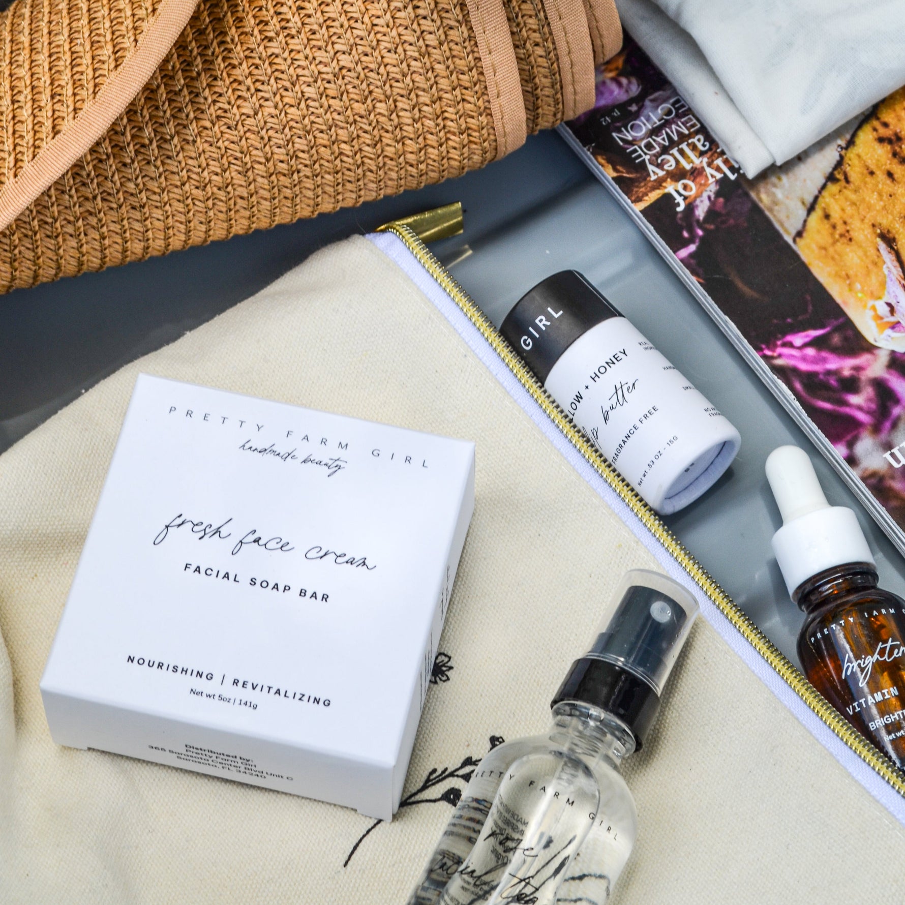 Collection of skincare products including a bottle and box on a textured surface.