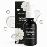 A black bottle of Pretty Farm Girl Emu Oil Serum with a white pump dispenser, shown in front of its black and white floral packaging box on a white background with decorative clear bubbles.