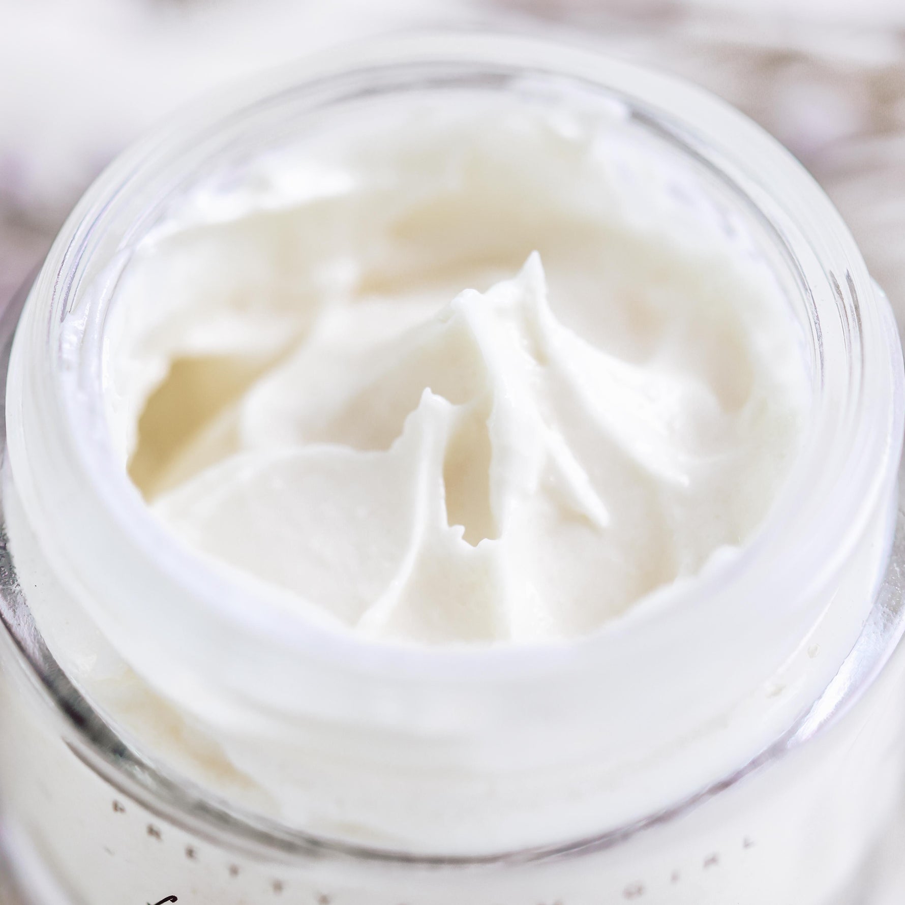 Close-up of a jar of white cream.