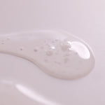 Close-up of Lactic Acid Serum texture showing a lightweight gel-like formula