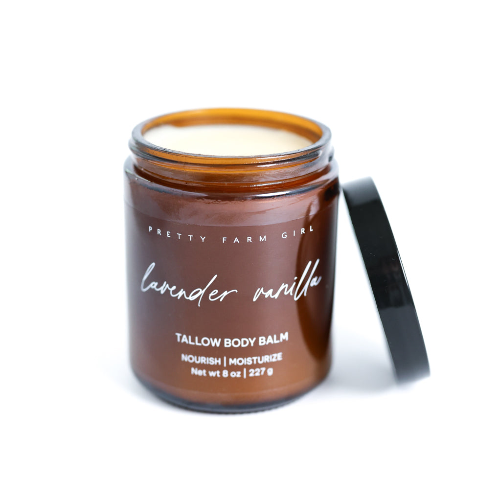 Pretty Farm Girl Lavender Vanilla Tallow Body Balm jar with black lid on a white background.