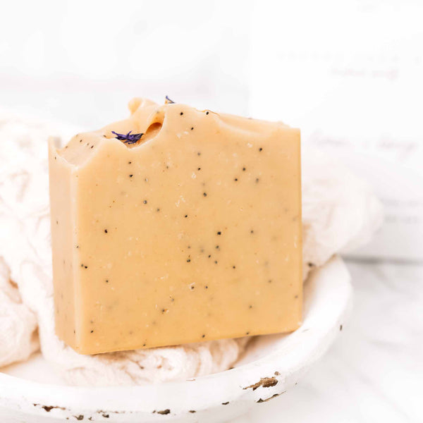 Lemon + Honey + Poppy Seed Soap Bar on a soft neutral background
