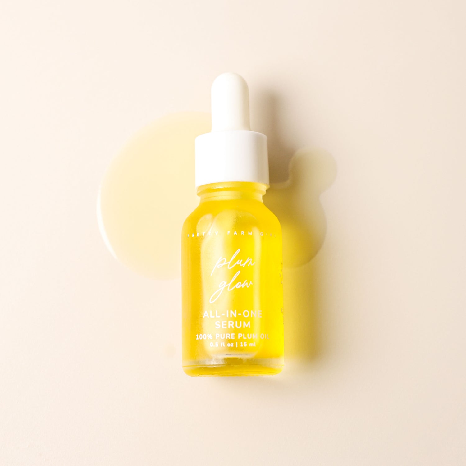 Plum Glow Multipurpose Face Serum bottle on a soft neutral background with golden plum oil texture