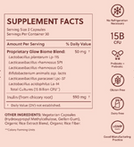 Supplement facts label with probiotic blend and ingredients on a pink background