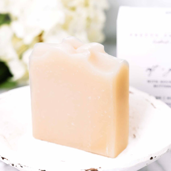 Soft + Gentle Buttermilk Soap Bar on a soft neutral background with product box