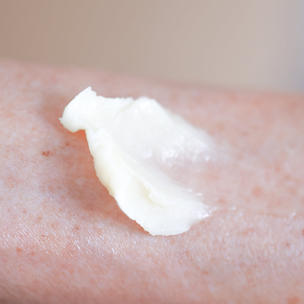 Pretty Farm Girl Tallow Calm Balm texture shown on skin.