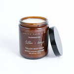 Pretty Farm Girl Tallow + Honey Tallow Body Balm jar with black lid on a white background.