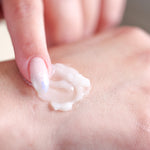 Pretty Farm Girl Tallow + Honey Tallow Body Balm texture shown on the back of a hand.