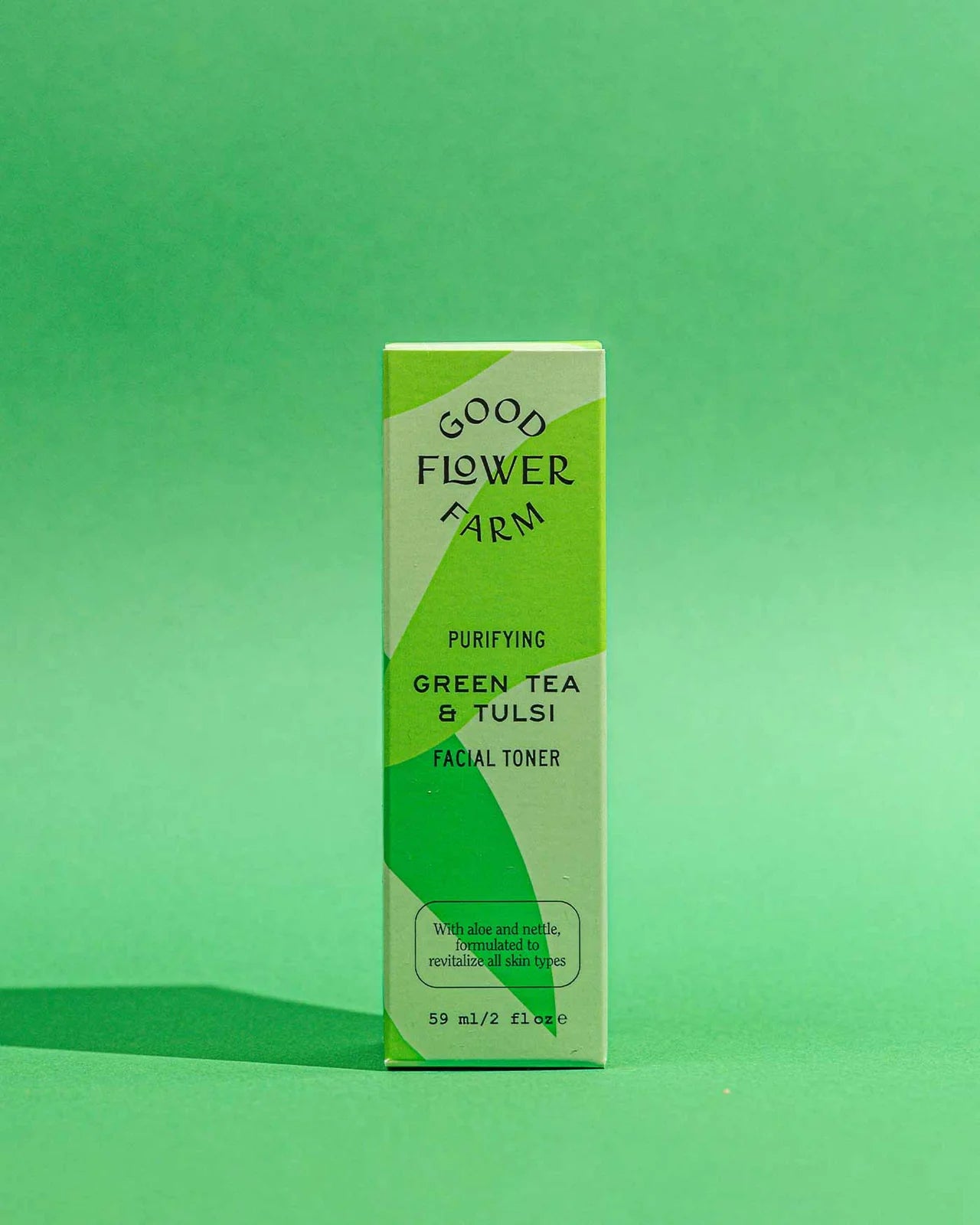 Good Flower Farm green tea and tulsi facial toner box on a green background