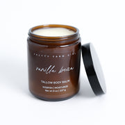 Pretty Farm Girl Vanilla Bean Tallow Body Balm jar with black lid on a white background.