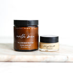 Two jars of 'Pretty Farm Girl' vanilla bean body butter and lip balm on a white surface.