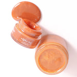 Jars of wildflower honey lip polish  showing the texture of the cream