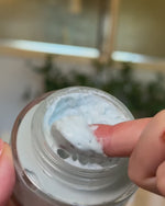 Video about How to use the Blue Beauty Cream, a woman is applying the cream on her face